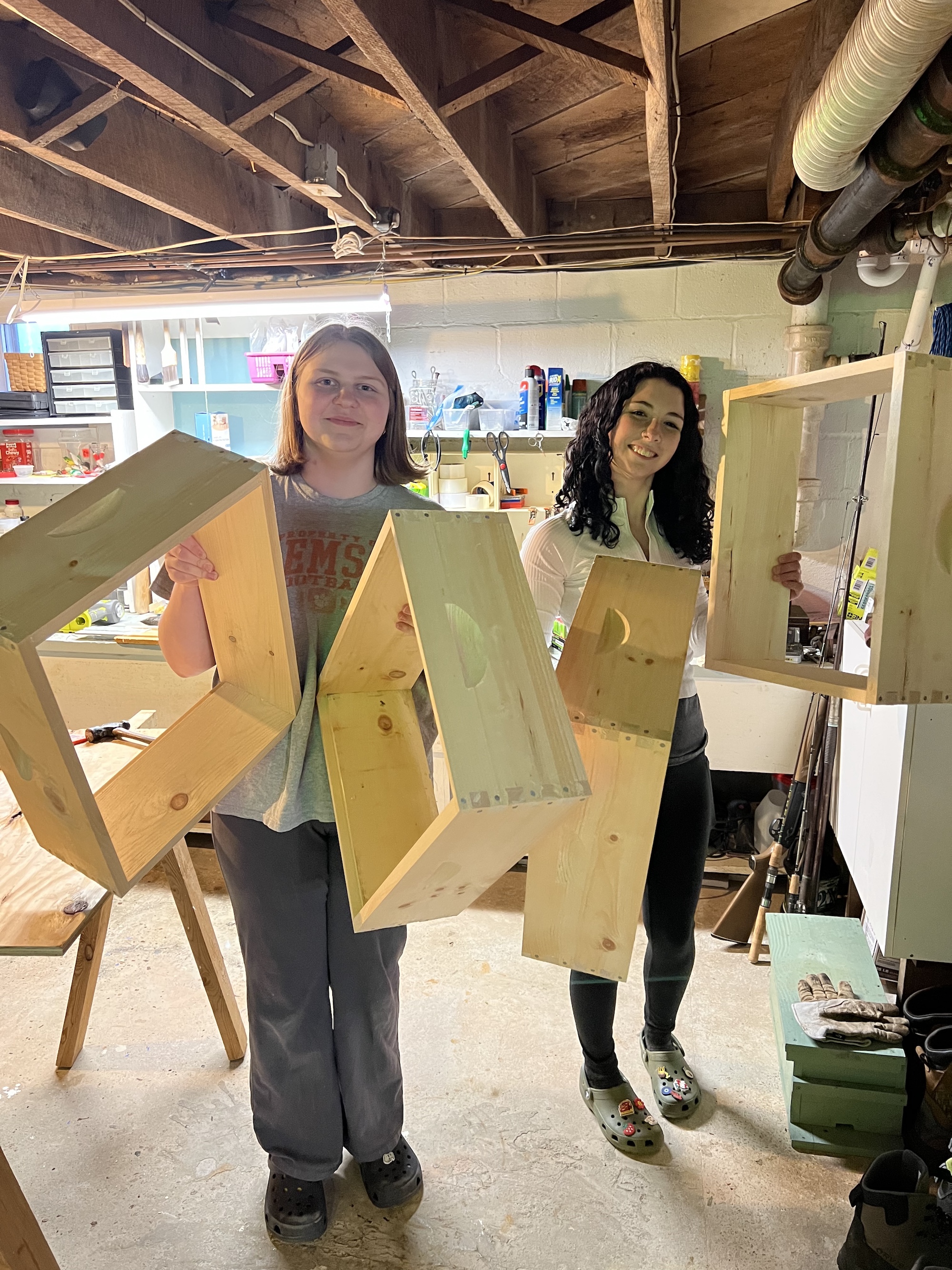 Young beekeepers with assembled woodenware