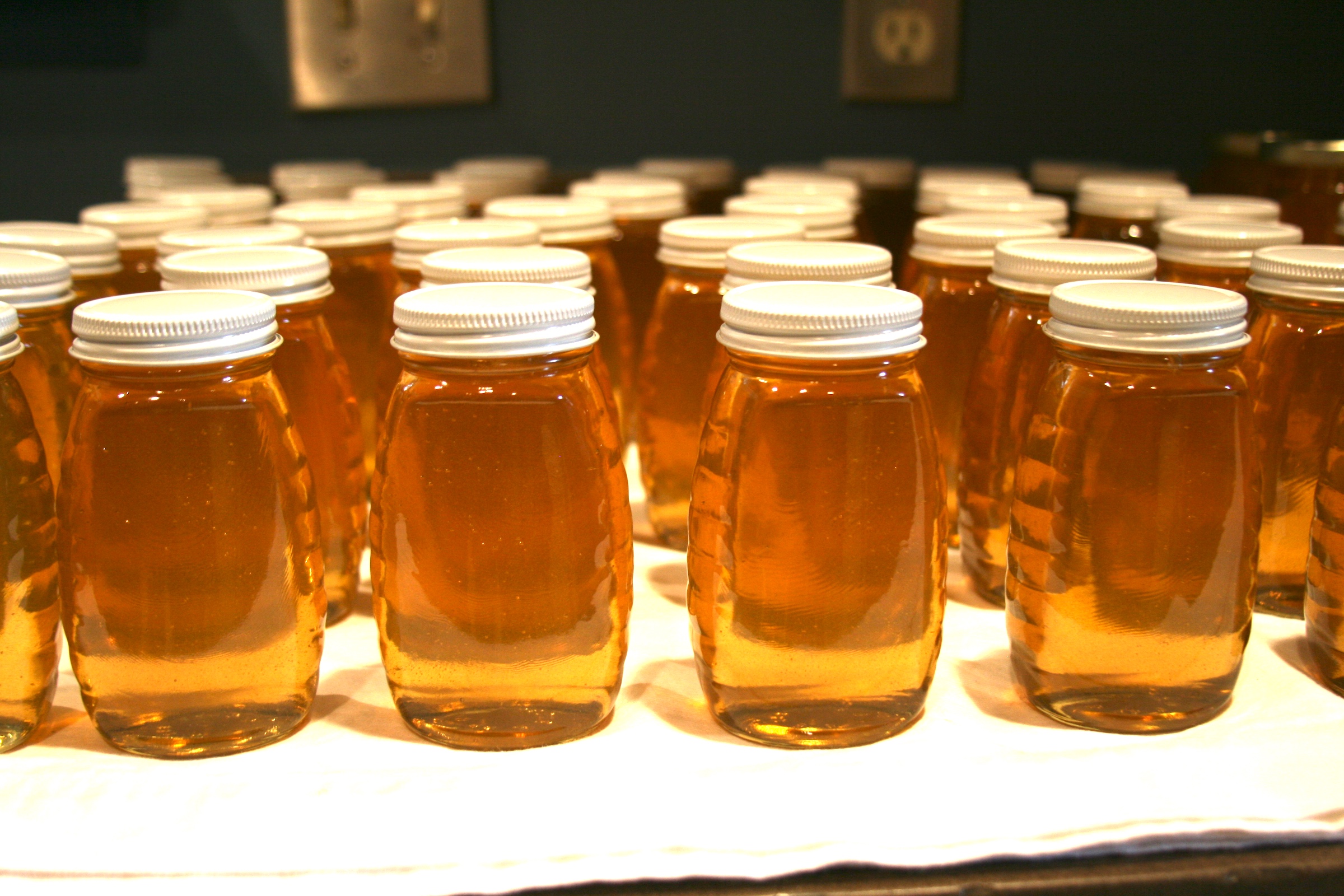 Jars of honey in rows